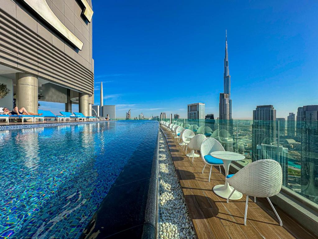 64th floor rooftop pool offering amazing Burj Khalifa views, 2BR apartment in Paramount Hotel Midtown