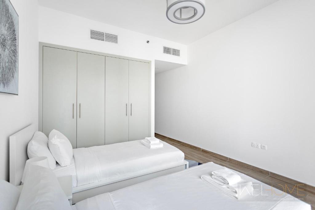 WelHome - Luxurious 2BR Apt at Noora Tower in Business Bay