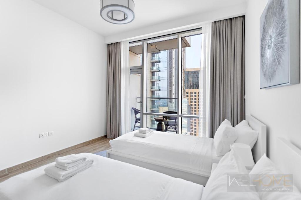 WelHome - Luxurious 2BR Apt at Noora Tower in Business Bay