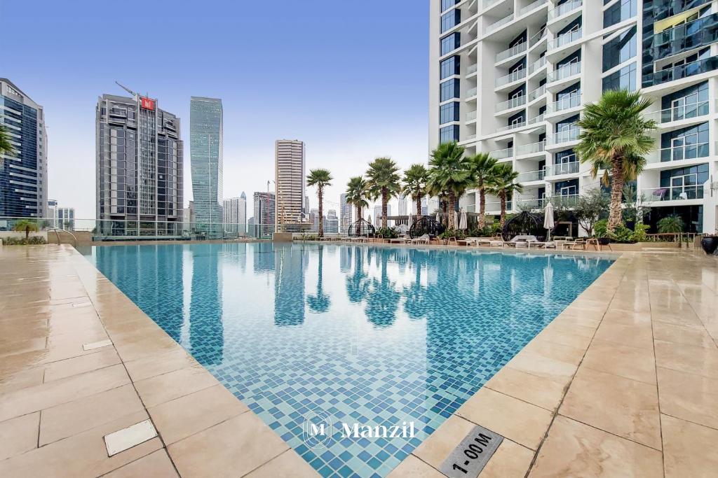 هتل منزیل - لوکژریس 1BR واترفونت آپارتمان در دامک میسون پریو ویت برج ویوز - Manzil - Luxurious 1BR Waterfront Apartment at DAMAC Maison Prive with Burj Views